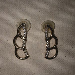 gold earrings with crystal gems.